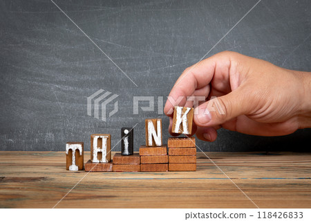 THINK. Wooden letters, alphabet blocks on steps. development and growth concept 118426833