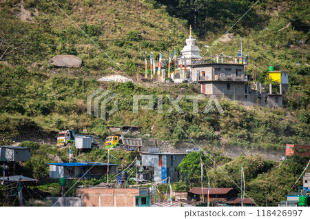 View of Syabrubesi village a beautiful resident village inside the Langtang National Park of Nepal. Syabrubesi lies at the base of a green hill on the way to Langtang Valley. View of Syabrubesi village a beautiful resident village inside the Langtang National Park of Nepal. Syabrubesi lies at the base of a green hill on the way to Langtang Valley. 118426997