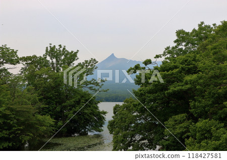 Mt. Komagatake, an active volcano between Mori town, Shikabe Town and Nanae towns on the Oshima peninsula in southwest Hokkaido as viewed from Onuma pond in the Oshima Park, near Hakodate 118427581