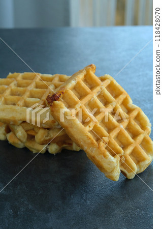 Belgian waffles on a dark background Belgian waffles on a dark background 118428070