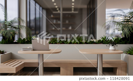 The interior design of a cozy contemporary coffee shop or co-working space seating area. 118428091