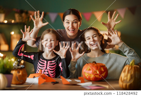 Happy family preparing for Halloween. Happy family preparing for Halloween. 118428492