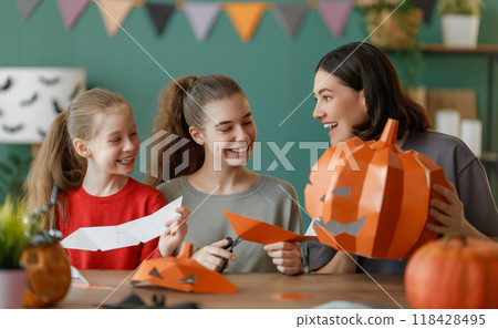 Happy family preparing for Halloween. Happy family preparing for Halloween. 118428495