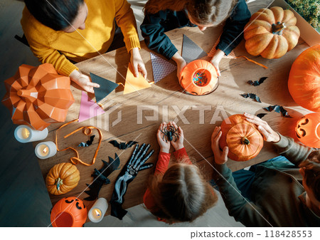 Happy family preparing for Halloween. Happy family preparing for Halloween. 118428553