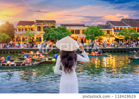 Asian woman wearing vietnam culture traditional at Hoi An ancient town,Hoi an city in Vietnam. 118428629