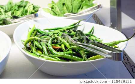Large dish of green chili peppers Large dish of green chili peppers 118429131