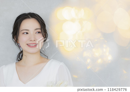 Young woman in a wedding dress 118429776