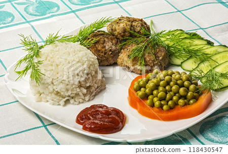 Home food. Cutlets with boiled rice and vegetables 118430547