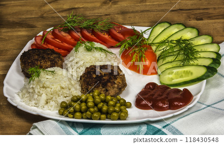 Fresh vegetables and boiled rice with meat katletami Fresh vegetables and boiled rice with meat katletami 118430548