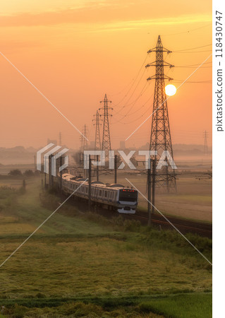 The Joban Line running with the autumn morning sun behind it The Joban Line running with the autumn morning sun behind it 118430747