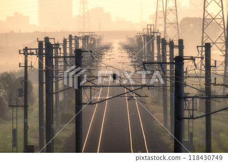 The Joban Line running with the autumn morning sun behind it The Joban Line running with the autumn morning sun behind it 118430749
