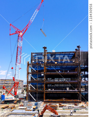 A building construction site with a large crane in operation 118430958