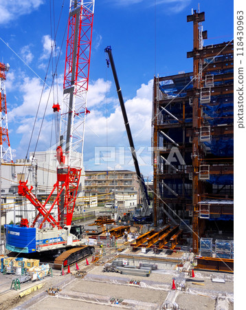A building construction site with a large crane in operation 118430963
