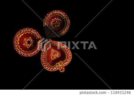 Happy Diwali - Top view of Diwali oil lamps on black background 118431246