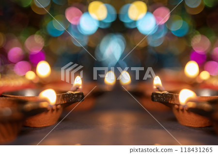 Glowing clay lanterns during Indian festival Diwali celebrations with bokeh effect background with copy space. Glowing clay lanterns during Indian festival Diwali celebrations with bokeh effect background with copy space. 118431265