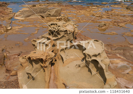 Eroded Sandstone Rock Formations by the Shoreline 118431640