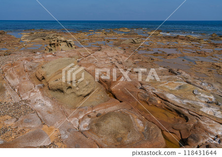 Eroded Coastal Rocks and Tide Pools by the Ocean Eroded Coastal Rocks and Tide Pools by the Ocean 118431644