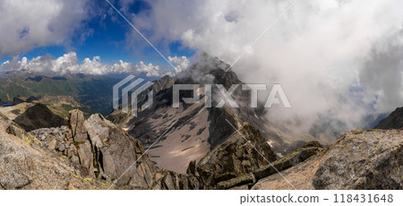 Panoramic Alpine View with Majestic Peaks and Cloud Cover 118431648