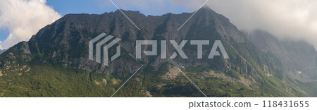 Panoramic Mountain Range Shrouded in Clouds 118431655