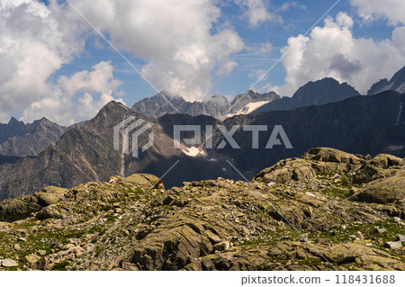 Mountain Range with Rocky Foreground and Snow-Capped Peaks 118431688