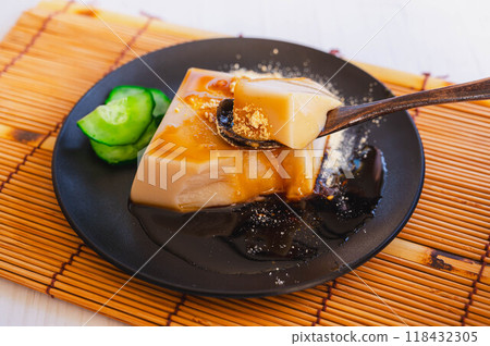 White sesame tofu with kinako and brown sugar syrup White sesame tofu with kinako and brown sugar syrup 118432305