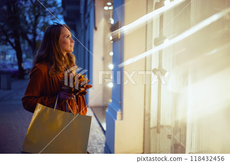 young 40 years old woman in brown trench coat 118432456