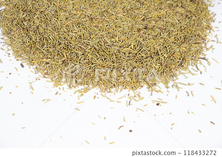 Pile of dried rosemary seasoning on a white background close-up. 118433272