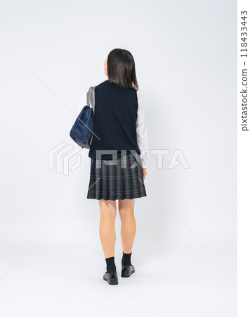 Full-body photo of a female student walking in uniform Full-body photo of a female student walking in uniform 118433443