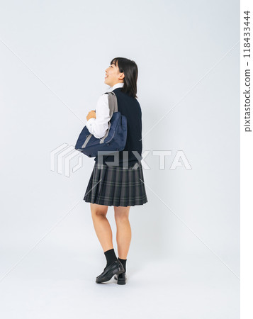 Full-body photo of a female student walking in uniform Full-body photo of a female student walking in uniform 118433444