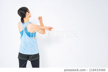 The back of a woman stretching The back of a woman stretching 118433480