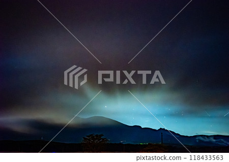 A few stars in the city lights of Yatsugatake and Chino City shining in the mist 118433563