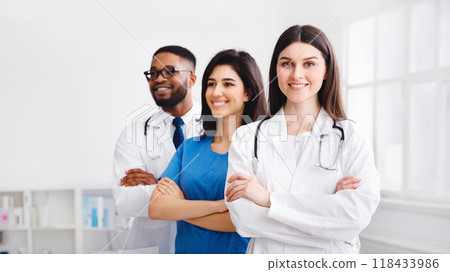 Tem of Confident Doctors And Interns Standing In Hospital With Crossed Arms 118433986