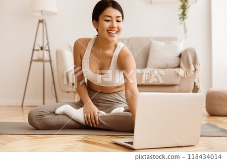 Online Training. Girl Doing Yoga Exercises And Watching Tutorial Lesson On Laptop 118434014