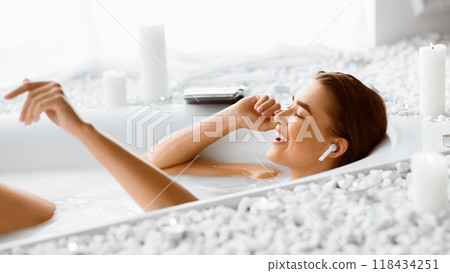 Relax In Bath. Woman Enjoying Music, Resting In Bathroom 118434251