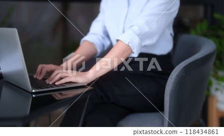 Asian businesswomen typing business information on keyboard laptop to working about planning of marketing business report while analyze investment and market stock of new startup in outside workplace Asian businesswomen typing business information on keyboard laptop to working about planning of marketing business report while analyze investment and market stock of new startup in outside workplace 118434861