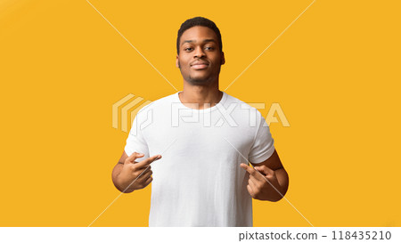 You Found Right Guy, Pick Me. Self-assured black man promoting himself, pointing at body over orange background 118435210