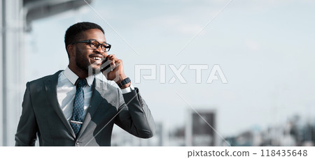 Call Taxi. African Businessman Arriving To Airport And Talking On Phone 118435648