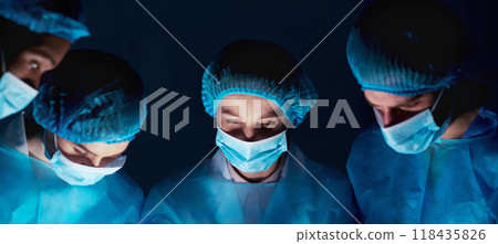 Surgeon At Work. Medical Team Performing Operation In Hospital Surgeon At Work. Medical Team Performing Operation In Hospital 118435826