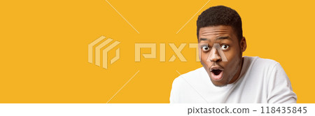 OMG. Portrait of shocked black man looking at camera with opened mouth, panorama, copyspace, orange background OMG. Portrait of shocked black man looking at camera with opened mouth, panorama, copyspace, orange background 118435845