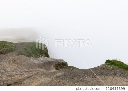 Cliffs of Moher disappear into mist under overcast sky Cliffs of Moher disappear into mist under overcast sky 118435899