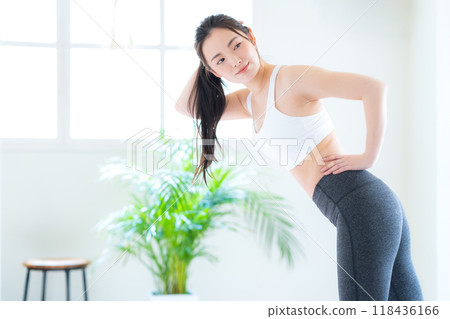 Young woman on a diet in the living room 118436166
