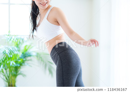 Young woman on a diet in the living room 118436167