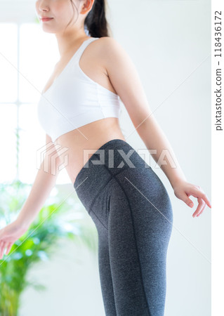 Young woman on a diet in the living room 118436172