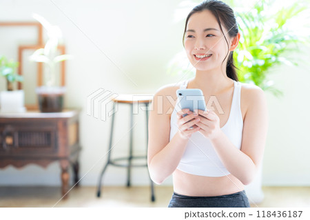 Young woman on a diet in the living room Young woman on a diet in the living room 118436187