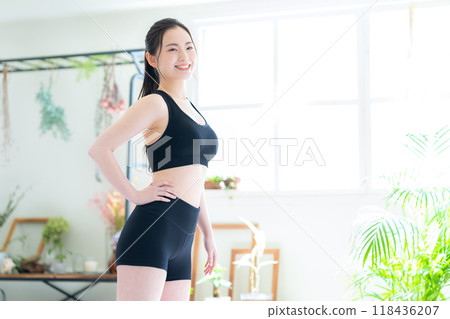 Young woman on a diet in the living room Young woman on a diet in the living room 118436207