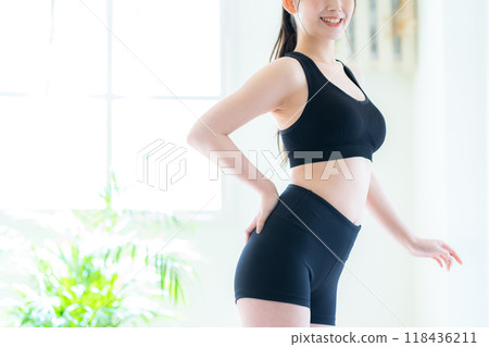 Young woman on a diet in the living room 118436211