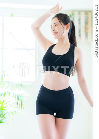 Young woman on a diet in the living room Young woman on a diet in the living room 118436213