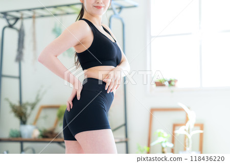 Young woman on a diet in the living room Young woman on a diet in the living room 118436220