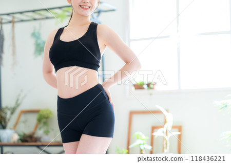 Young woman on a diet in the living room Young woman on a diet in the living room 118436221