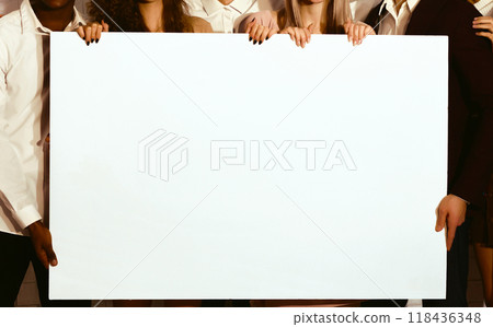 Unrecognizable Young People Holding Blank White Poster For Text Standing Indoor. Mockup, Cropped Unrecognizable Young People Holding Blank White Poster For Text Standing Indoor. Mockup, Cropped 118436348